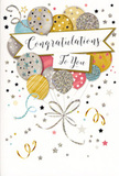 The photograph captures a refined congratulations card whose artwork feels as uplifting as hearing good news shared over coffee in a Beddington kitchen. Central to the design is a cluster of round, softly luminous balloons gathered like a hand-tied arrangement, rising from the bottom edge of the card with an easy, upward sweep. The balloons are painted in harmonious tones of champagne gold, shining silver, soft sky blue, pale blush pink, and cool grey, their surfaces subtly highlighted to suggest a gentle sheen rather than harsh shine. Each balloon is individually decorated: some sparkle with tiny star motifs, others feature slim glittering stripes, while a few are dotted with delicate specks that catch the eye and imply a tactile, slightly raised texture. From their base, slender ribbons in illustrated gold and silver flow downward in loose curls, visually tying the composition together much as ribbon secures the stems of a celebratory bouquet delivered around Beddington and nearby streets. Scattered across the pale background are small metallic stars, dots, and graceful swirls that evoke drifting confetti and the lingering energy of a party. A curved banner stretches elegantly through the centre, holding the phrase Congratulations To You in flowing, hand-lettered script that conveys warmth and sincerity. The design feels balanced and carefully crafted, rooted in a sense of considered celebration rather than noisy spectacle. Imagined under your fingertips, the slight roughness of glitter and the smooth density of good-quality card echo the tactile pleasure of unwrapping flowers. Altogether, the card radiates joy, pride, and understated glamour-perfect for celebrating a promotion, exam success, or any special achievement treasured by families in Beddington.